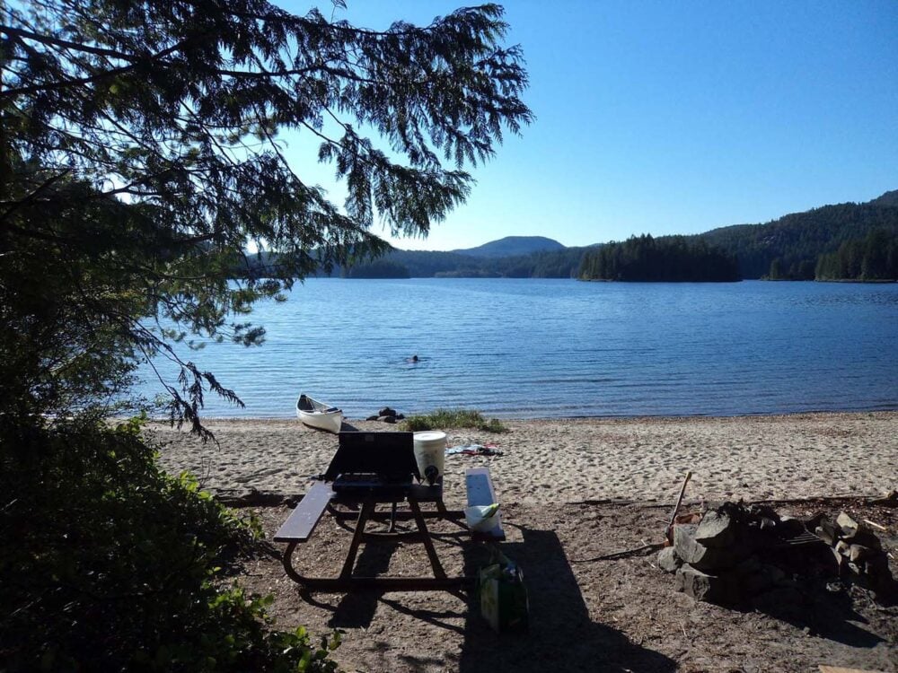 Campsite with canoe at Main Lake Vancouver Island