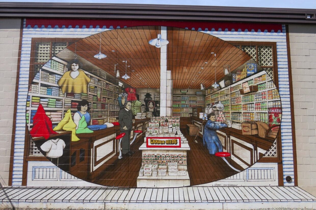 Close up of mural in Chemainus featuring a shop scene in the early 20th century