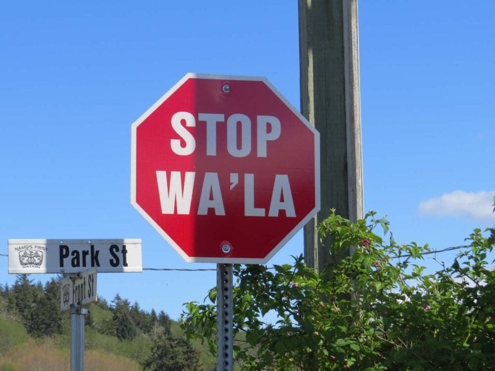 Stop and "Wa'la" on a red sign