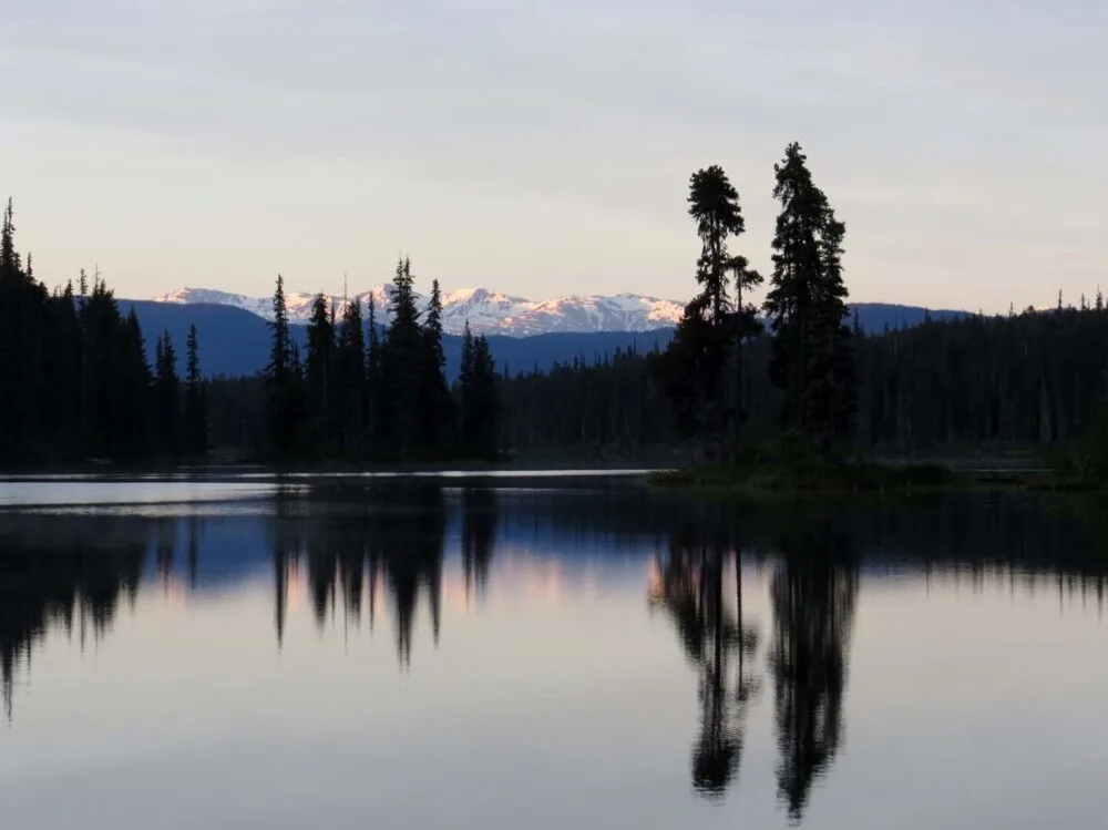 Mirror lake reflections of mountains and trees