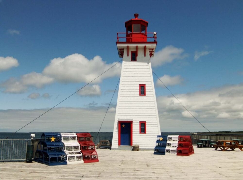 Light house painted in the Acadian flag colors 