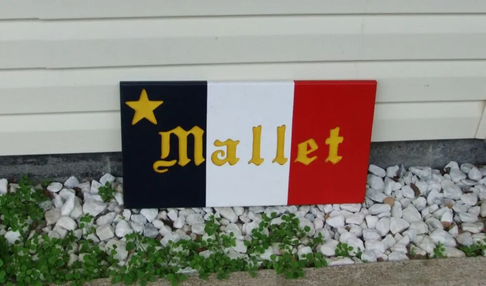 Close up of Acadian flag decoration with Mallet name on front