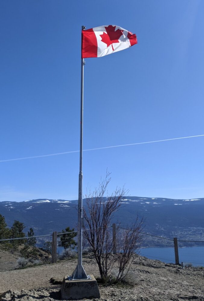 Flying Canadian flag on post at the top of Giant's Head Mountain