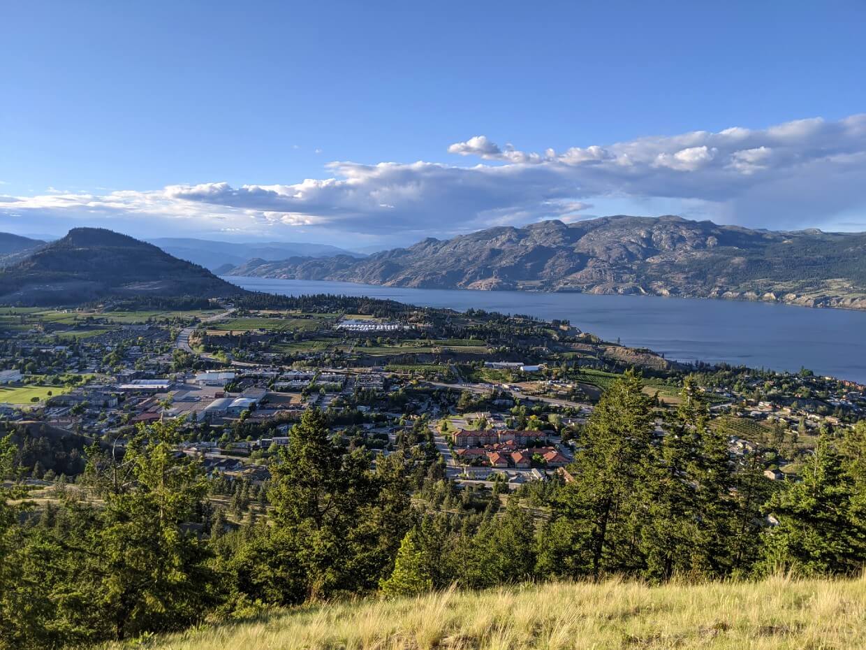 View from Friendly Giant Trail on Giant's Head Mountain, lookign own to the town of Summerland, with Rattlesnake Mountain on left, Okanagan Lake on the right with the rugged peaks of Okanagan Mountain Park in the background