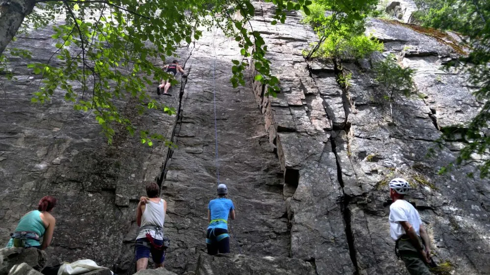 Climbers ascend rockface in Skaha Bluffs, Penticton