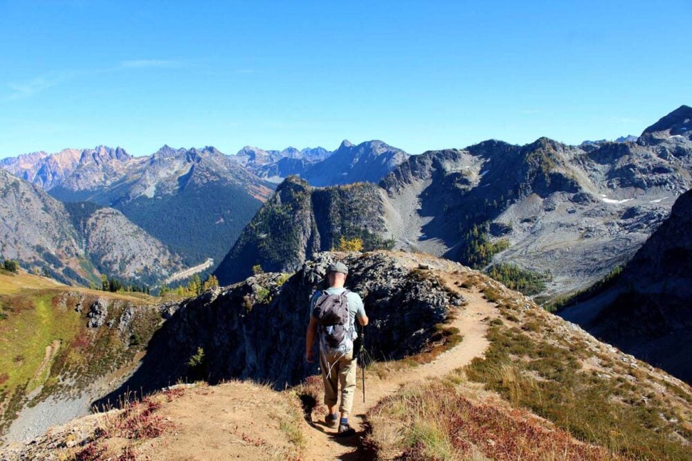 Hiking on a ridge surrounded by mountains