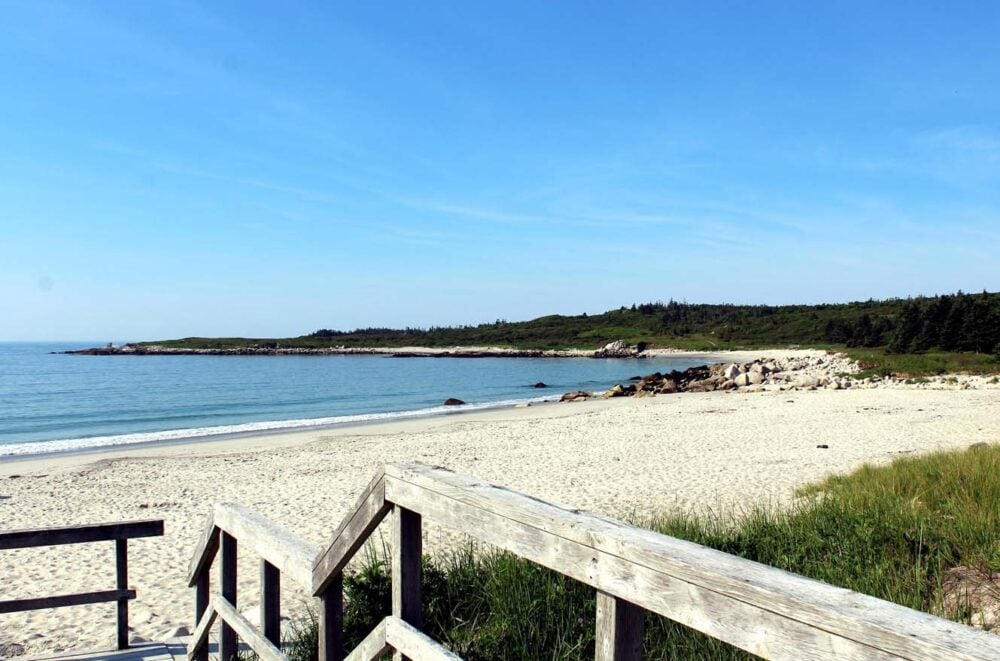 The golden sands of Crystal Crescent beach, at the start of the Pennant Point trail