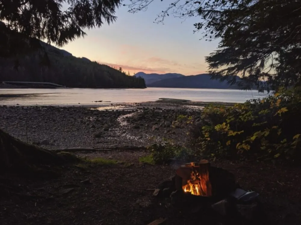 Campfire scene looking out to ocean on Vancouver Island