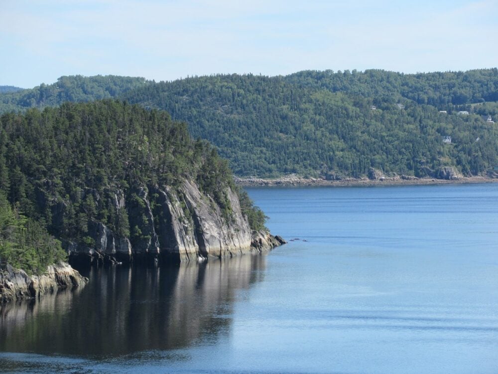 Calm ocean with fjord cliffs in Saguenay