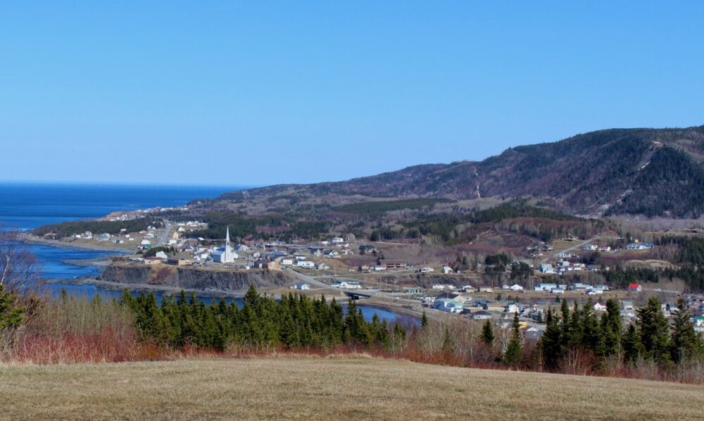 Coastal village with church and small houses on the Gaspe Peninsula