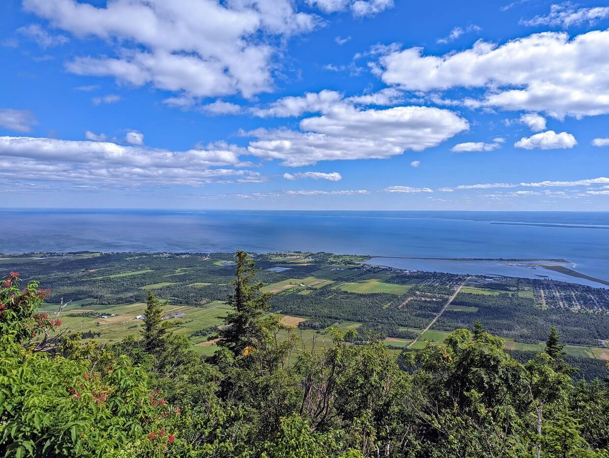 Elevated view looking down over pastoral and ocean scenery in Carleton-sur-mer from Mont Saint Joseph 