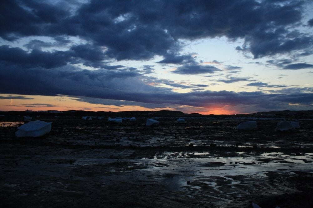 Sunset behind icebergs near Iqaluit, Nunavut