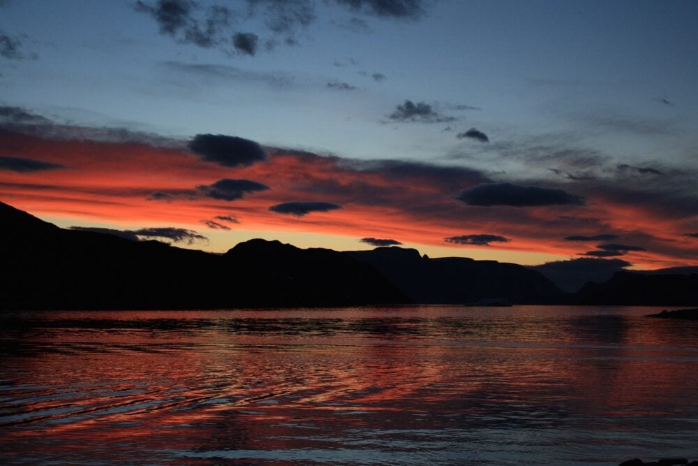 Red sunset over water near Iqaluit, Nunavut