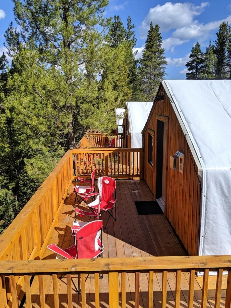 Three tent decks with Canada themed chairs at Mount Engadine Lodge