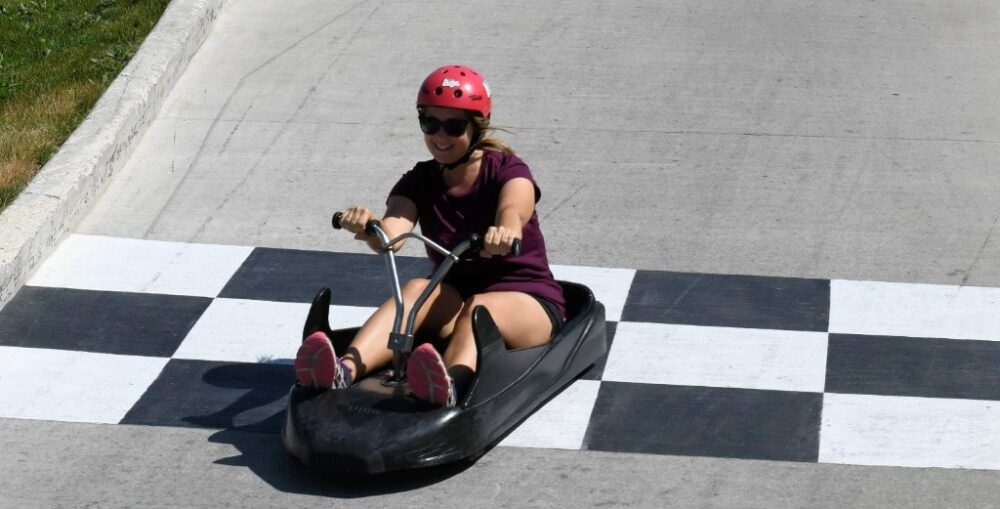 Gemma riding go kart on Skyline Luge, WinSport