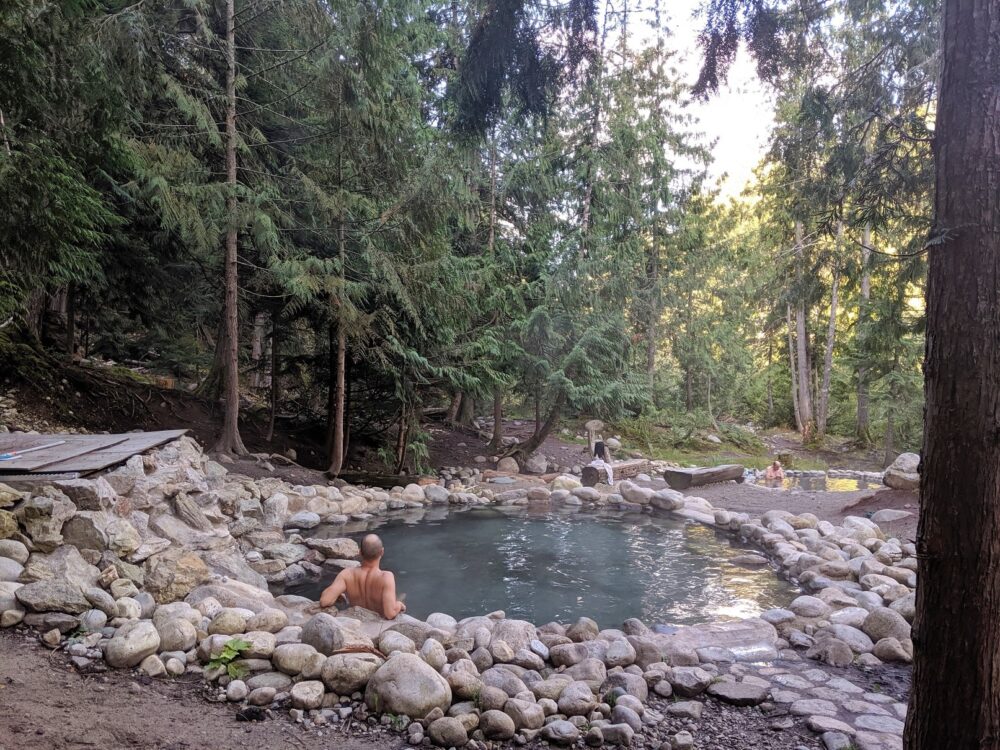 JR sat in hot springs pool at Halfway Hot Springs