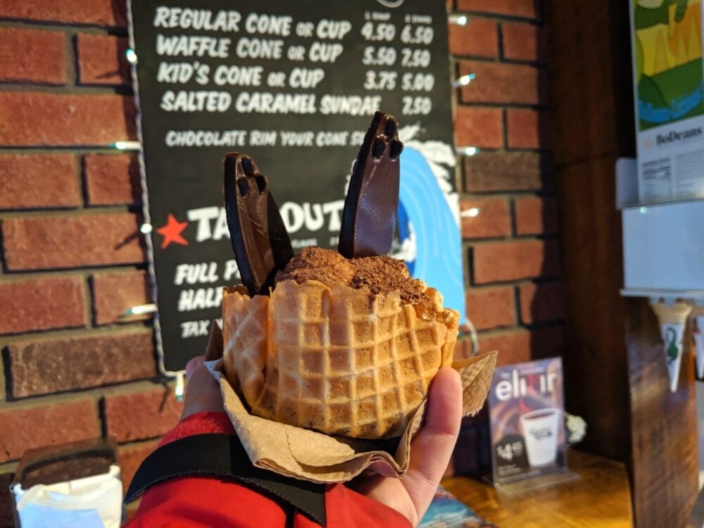 Ice cream cup with chocolate gelato and chocolate surfboards