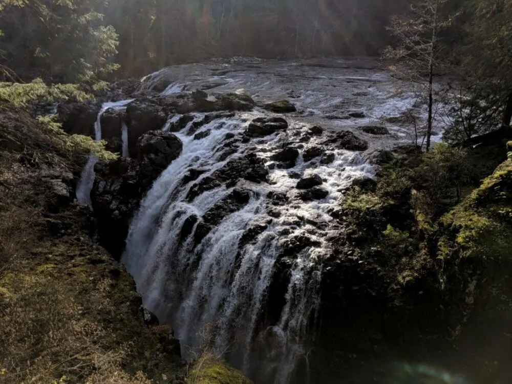 A multi-stream waterfall falls down into a canyon