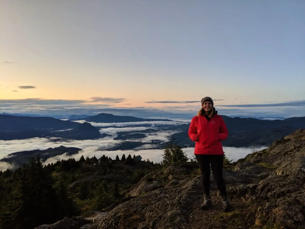 Gemma in front of sunrise views on Tin Hat Mountain