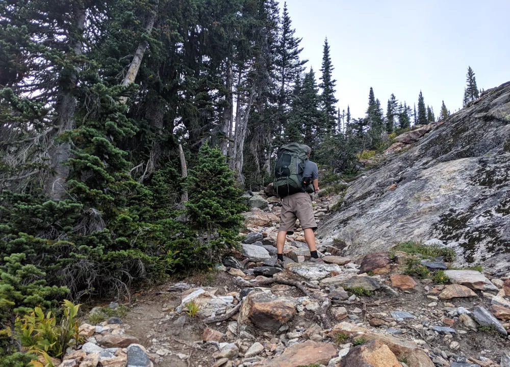 JR stopping to pause on a rocky ascent up to Gwillim Lakes, Valhalla Provincial Park