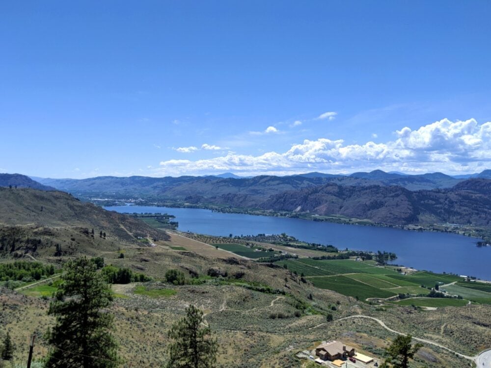 Elevated view looking down on Osoyoos Lake lined with brown hills