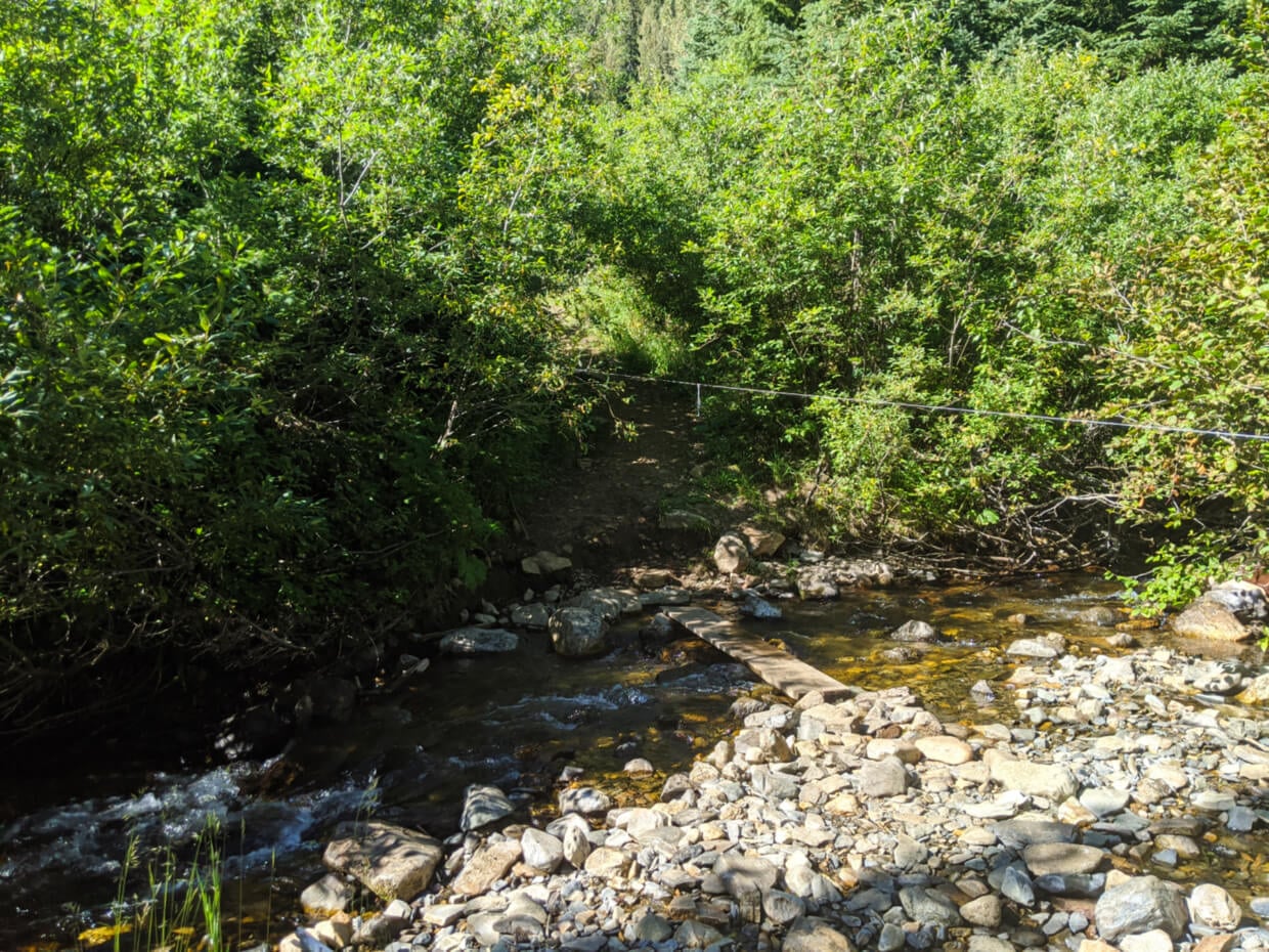Rocky creek crossing with plan of water over water with rope guide