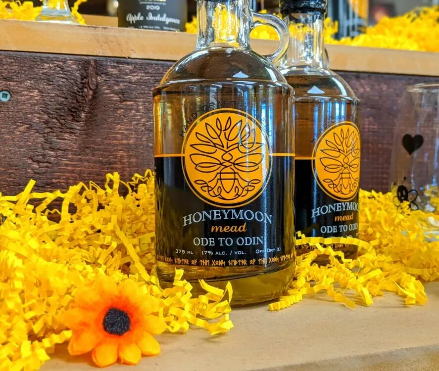 Two bottles of Ode to Odin Honeymoon Mead on tasting bar at Plant Bee Honey Farm in Vernon