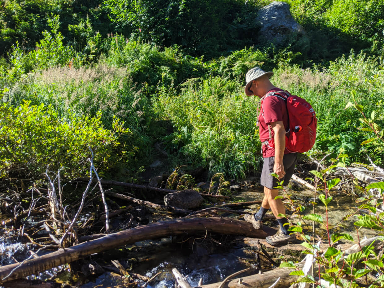 JR crossing Railroad Creek on logs and rocks