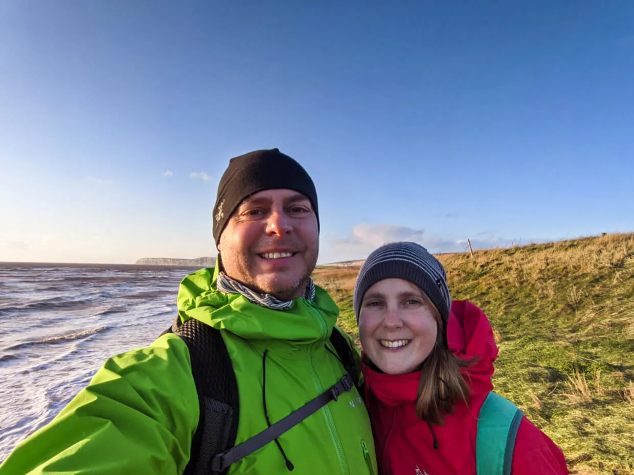 Gemma and JR selfie in font of coastal scenery in UK