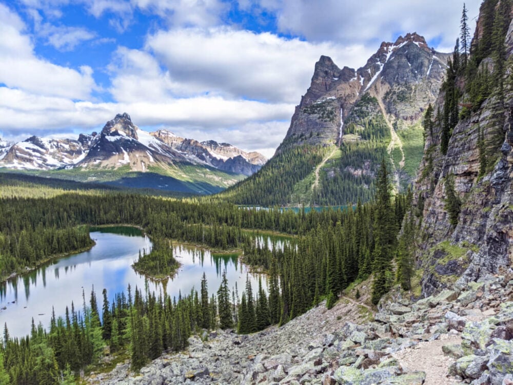 Elevated view looking down on multiple lakes surrounded by mountains in Lake O'Hara, Yoho National Park