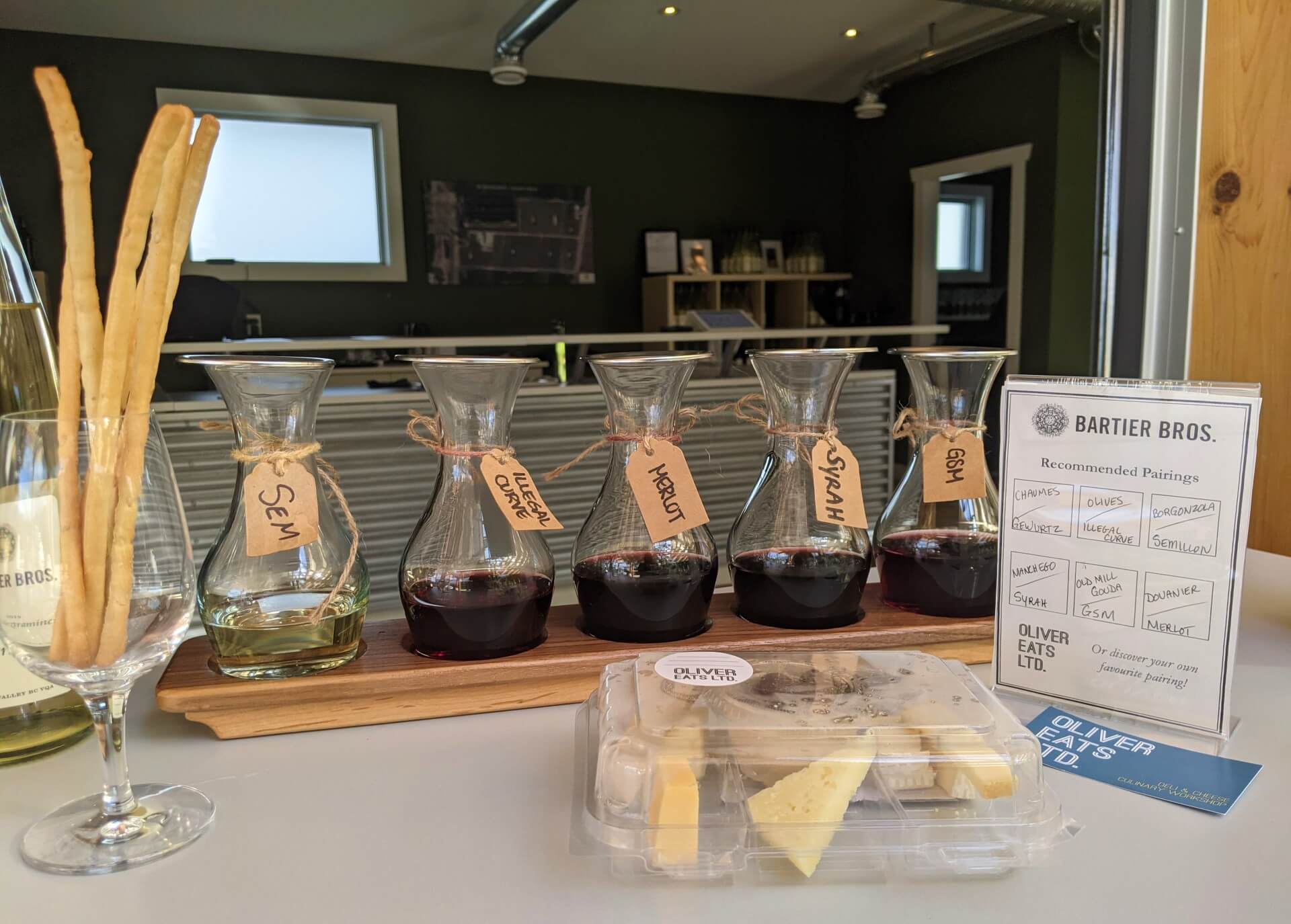 Close up of wine tasting flight with package of cheese at Bartier Bros. 