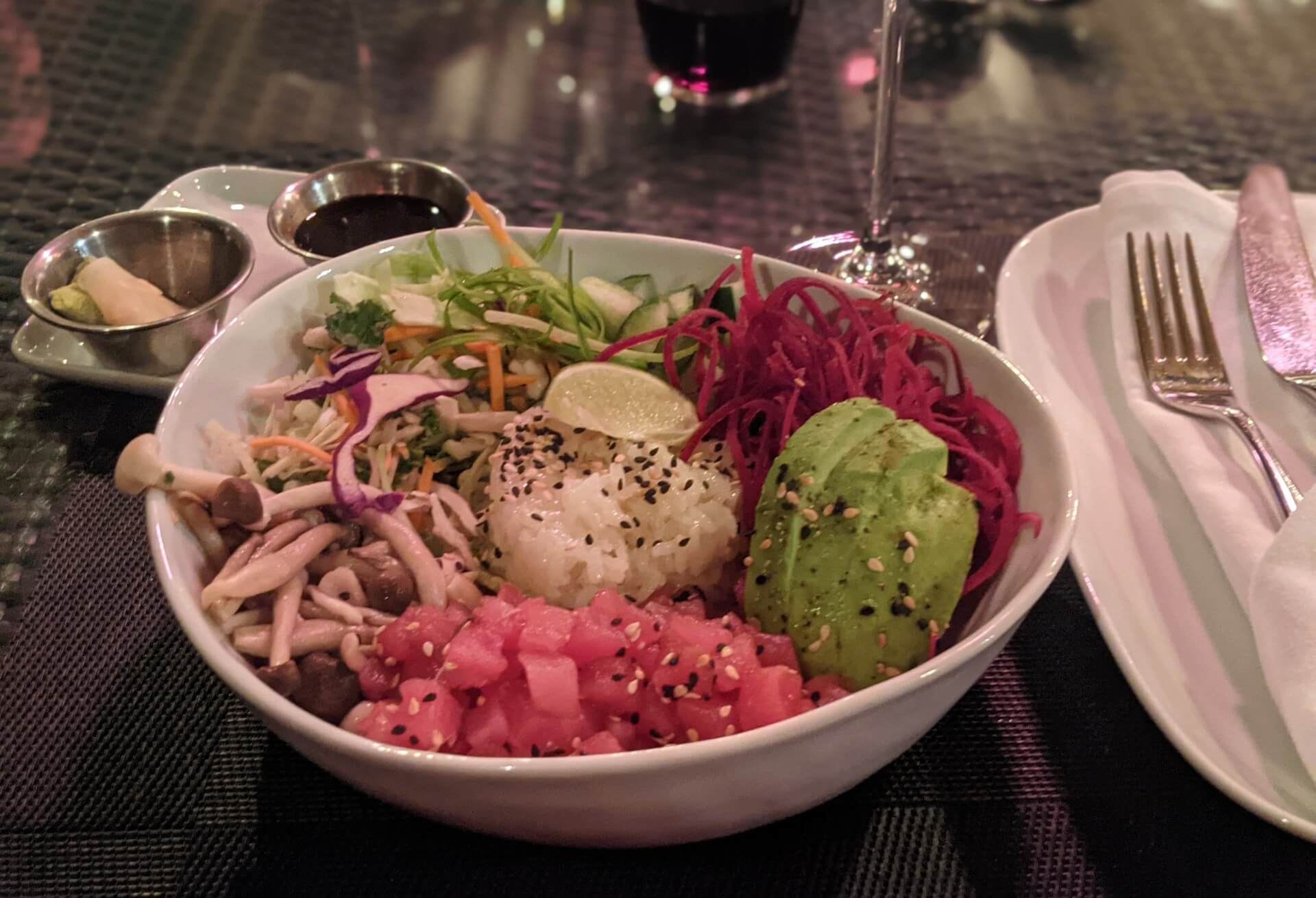 Front on view of poke bowl at 15 Park Bistro, with pickled ginger, avocado, rice, cabbage and tuna