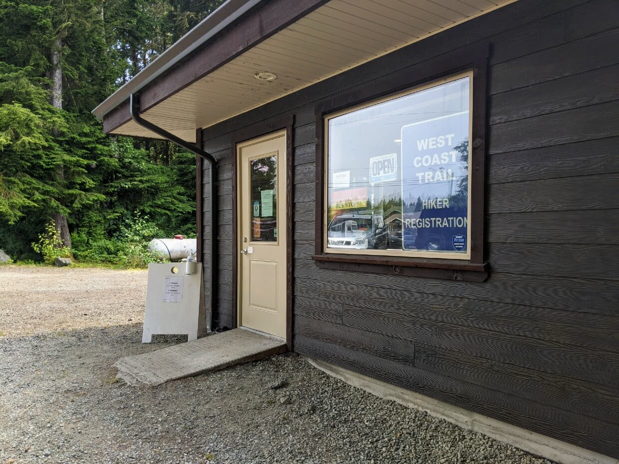 Side close up view of wooden West Coast Trail Hiker Registration building