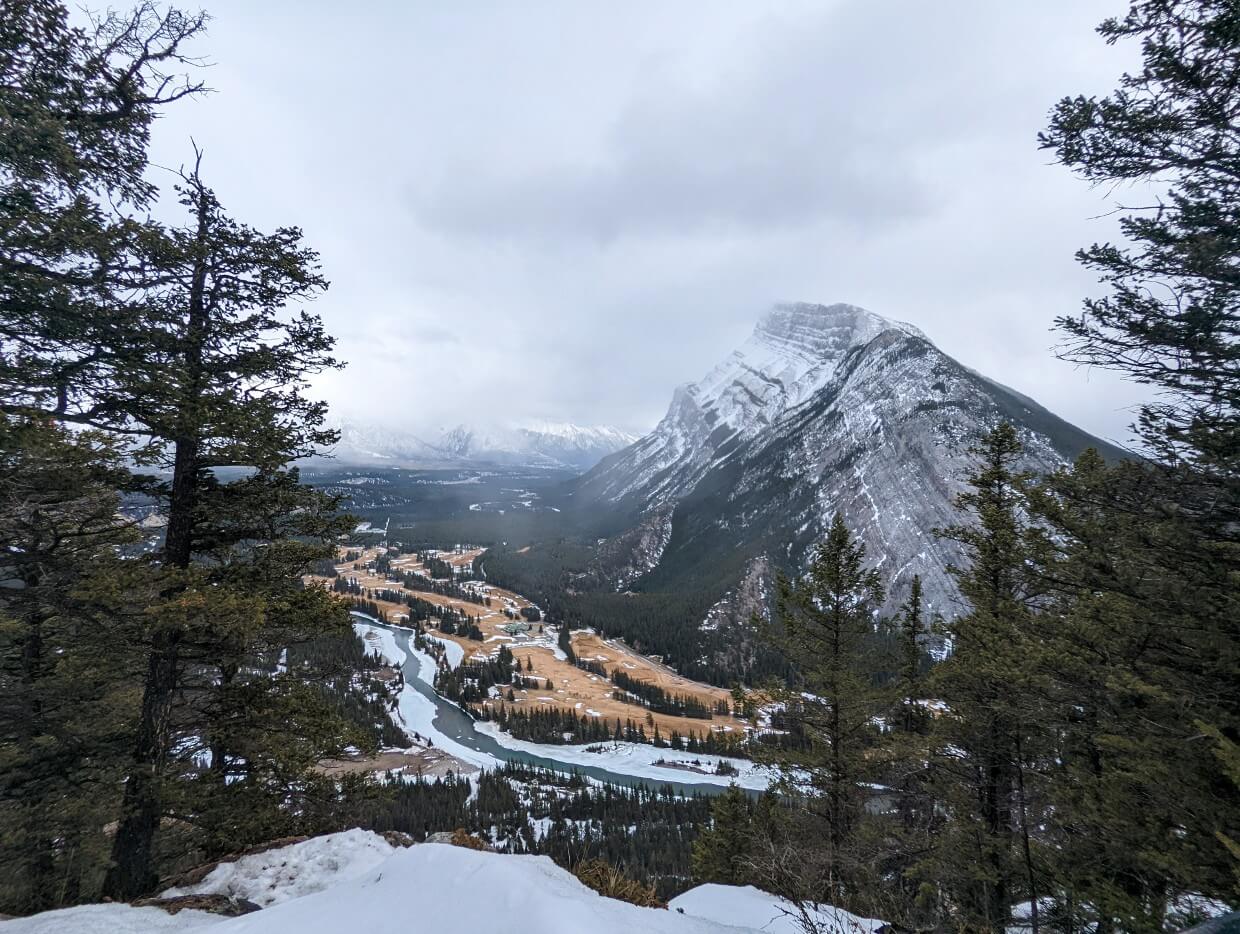 Viewpoint view at Tunnel Mountain, looking towards the slopes of Mount Rundle, which has a golf courseand river at its base