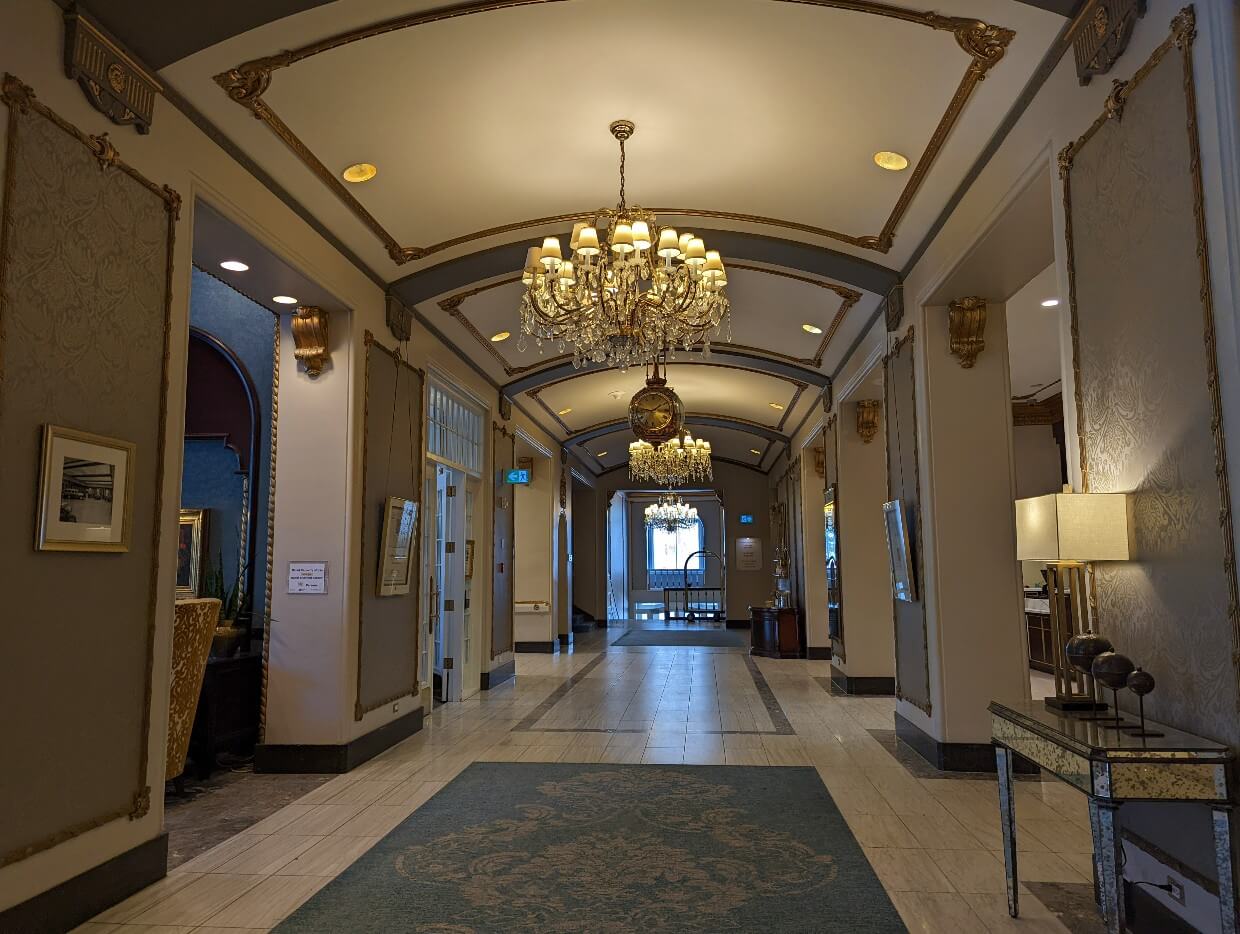 Luxury lobby at Hotel Saskatchewan with chandeliers and tall ceilings