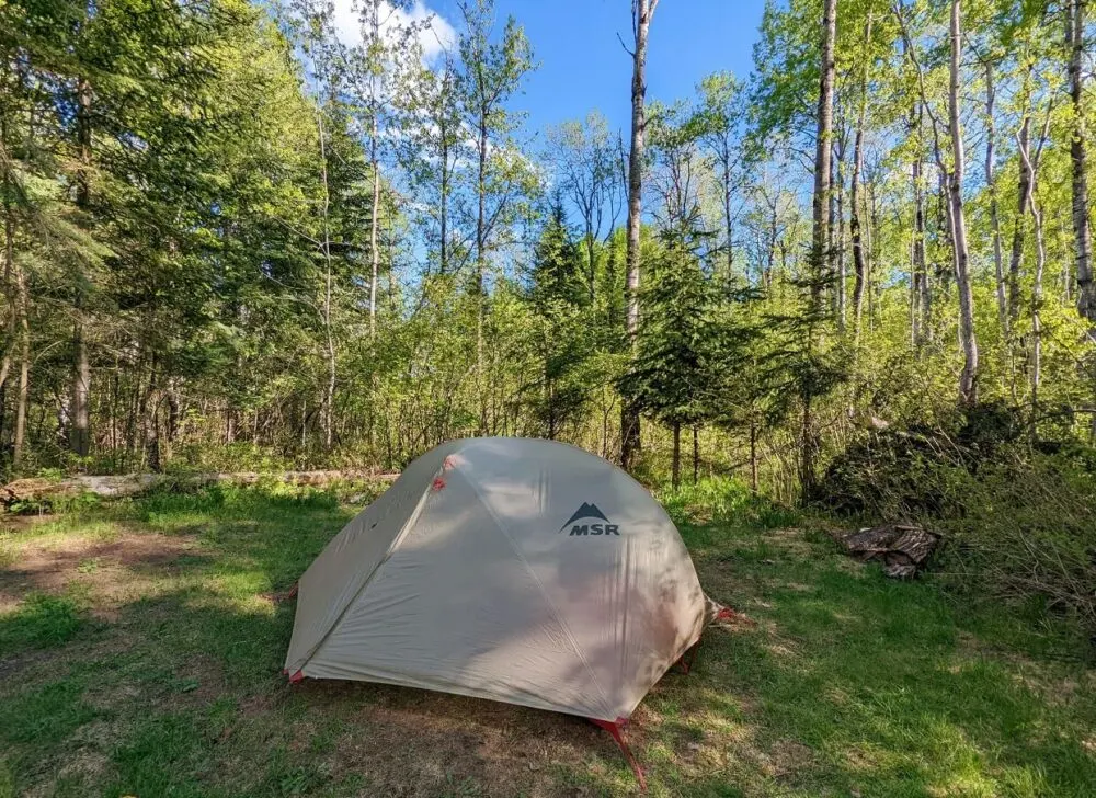 Set up tent in front of forest in Kakabeka Falls Provincial Park
