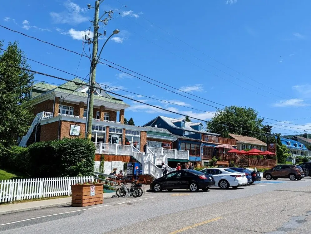 Looking across road to shops and restaurants in downtown Tadoussac