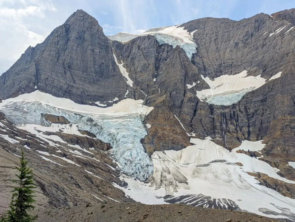 Close up of huge multi layered glacier on the Rockwall Trail, on the side of a rugged mountain