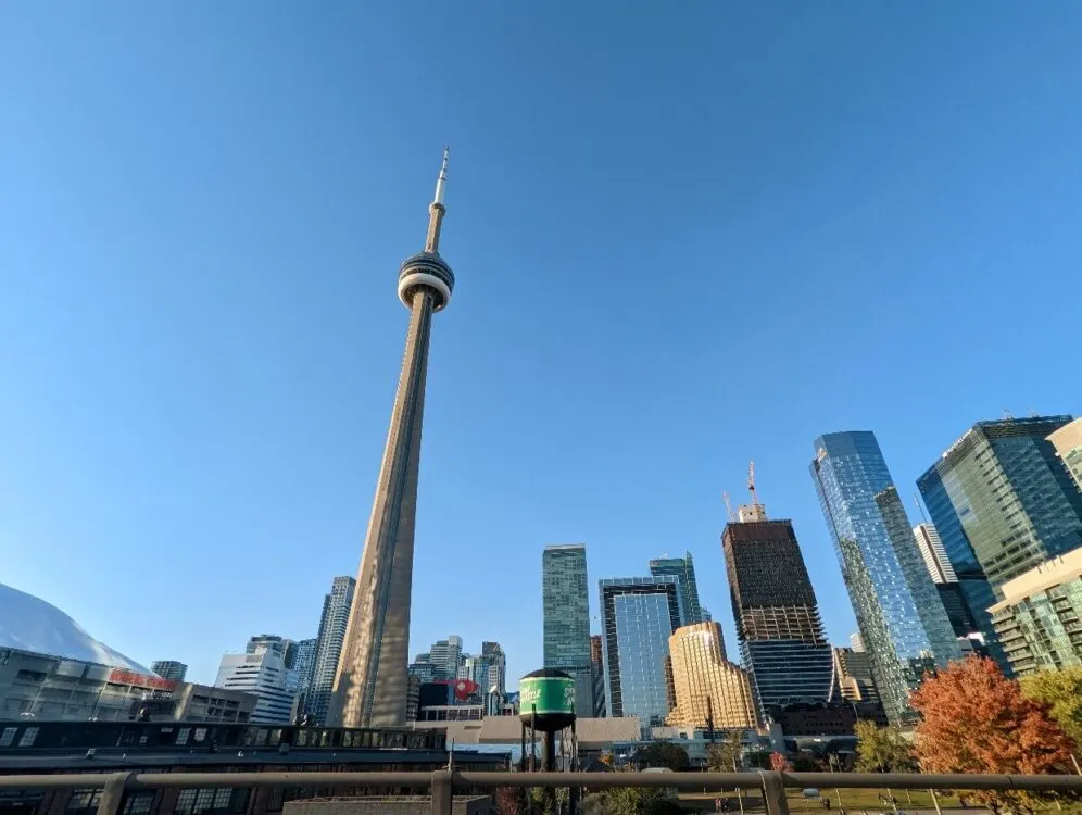 Looking up to the CN Tower and other high rise buildings in downtown Toronto