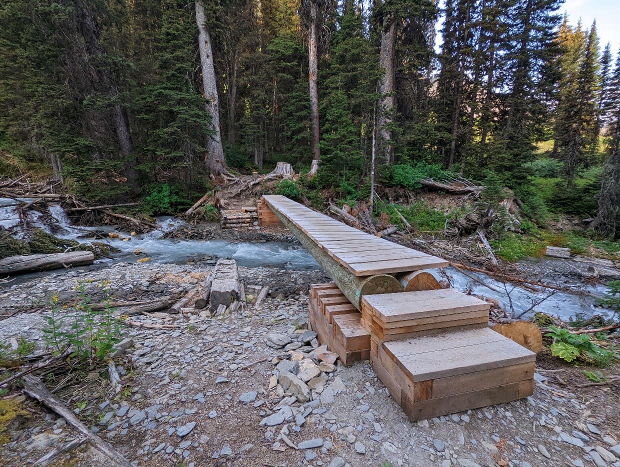 A brand new wooden bridge spans Numa Creek on the Rockwall Trail