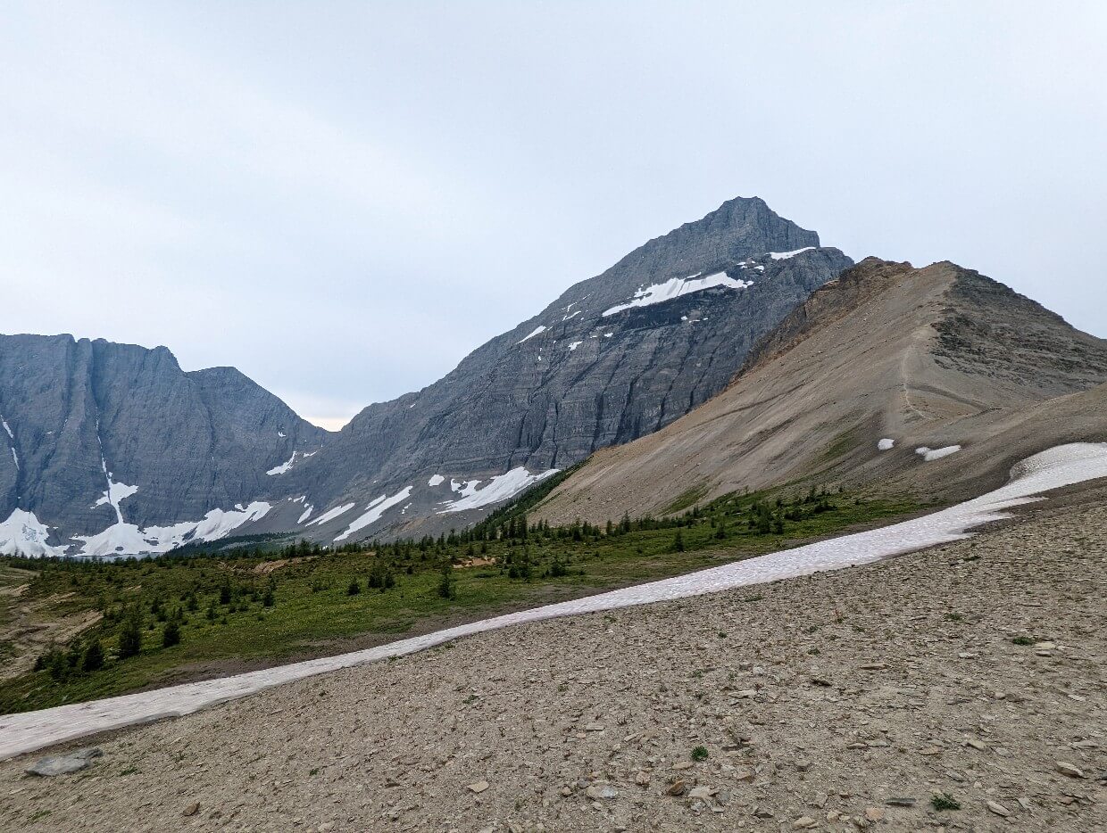 Looking up at rocky ridge, which leads to huge mountain on Numa Pass