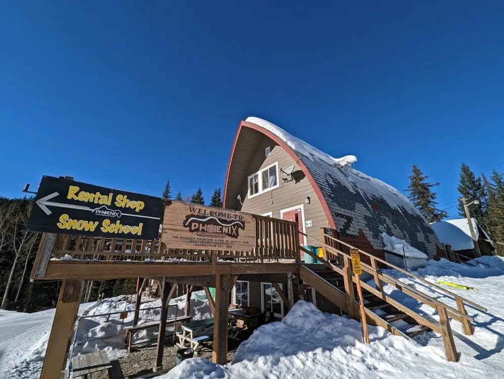 Looking up at A shaped cabin building at Phoenix Mountain on sunny day