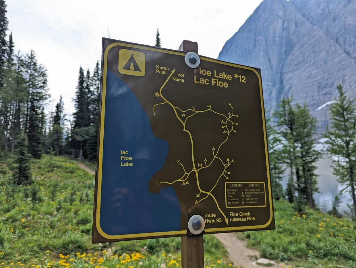 Close up of metal Parks Canada Floe Lake Campground map, with trails and campsites marked