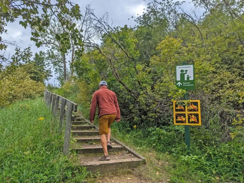 Back view of JR walking up stairs to viewpoint at Rochon Sands 