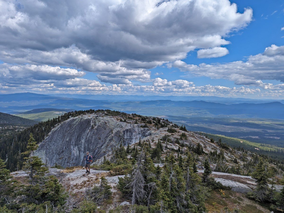 Little White Mountain granite wall with JR standing in front of almost vertical cliff