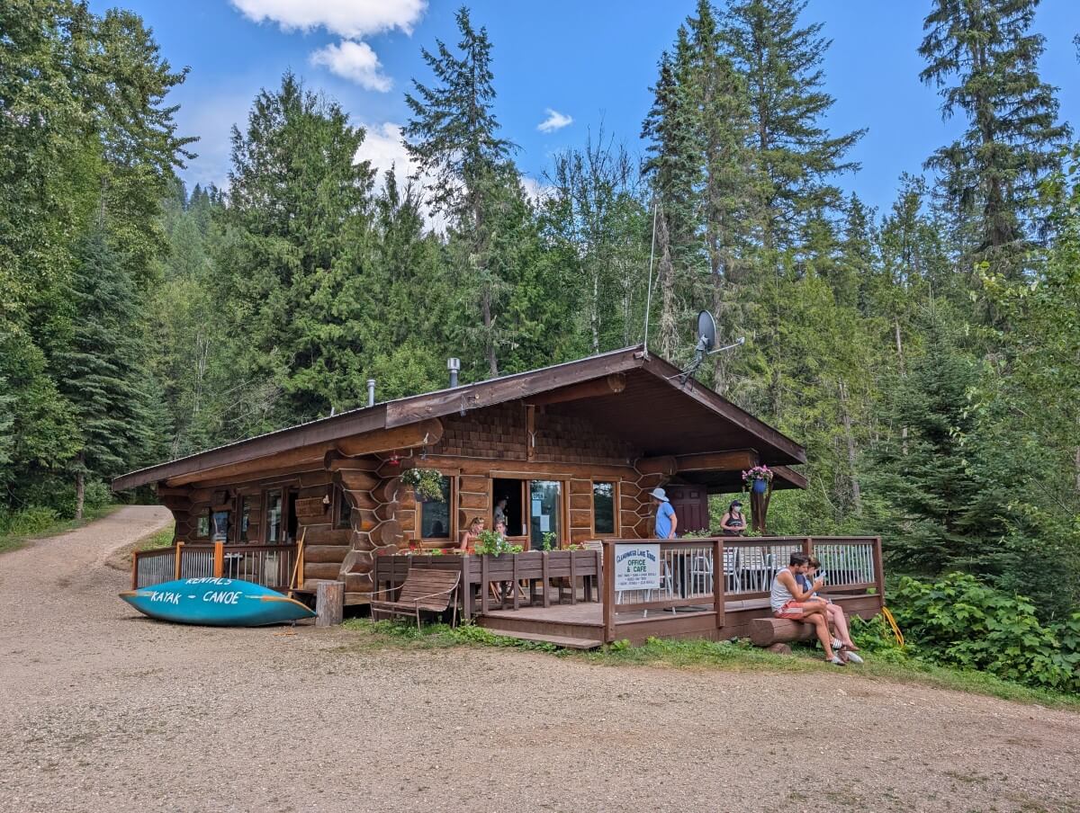 Osprey Cafe in Wells Gray Provincial Park, a small cabin with an open deck at the front, backdropped by forest