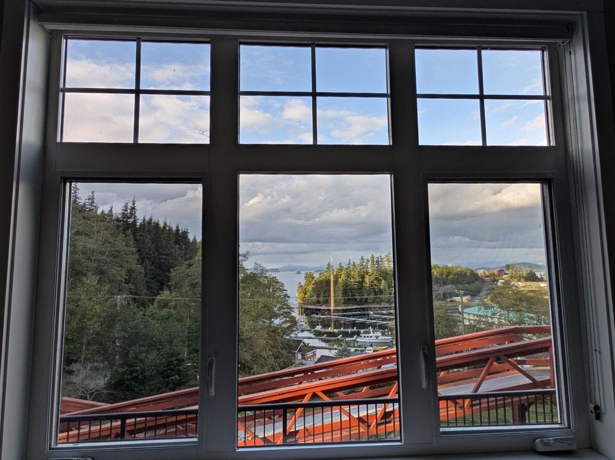 Telegraph Cove Resort hotel room view from window, showing ooden staircase and ocean views