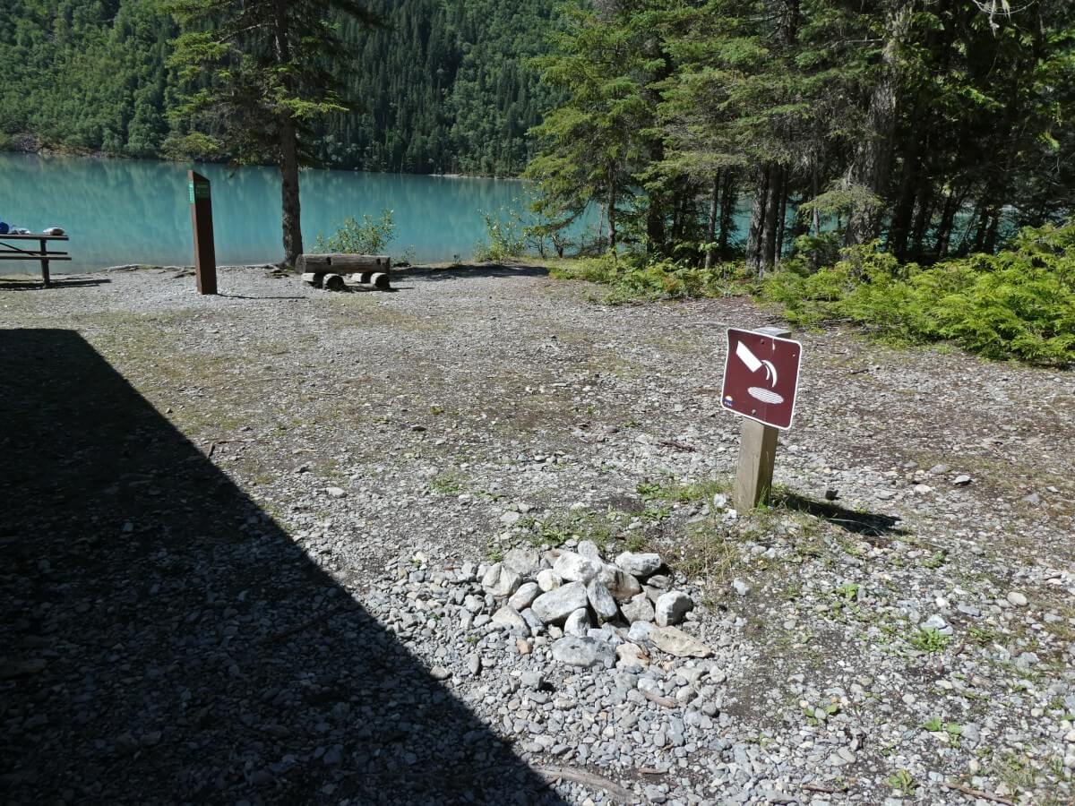 Kinney Lake grey water disposal area with rock pile and signage