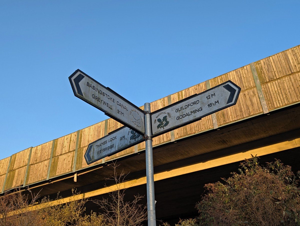Close up on signage at the end of the Basingstoke Canal Towpath, showing Greywell is 31 miles away