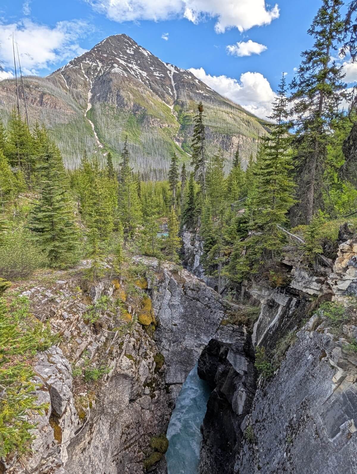 Bridge view looking down on deep, narrow Marble Canyon with rushing river below